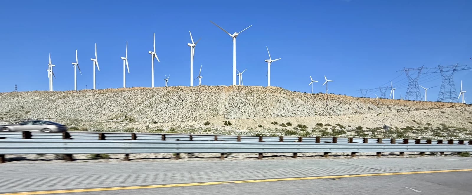 Wind turbines of the San Gorgonio Pass Wind Farm operating under clear skies.
