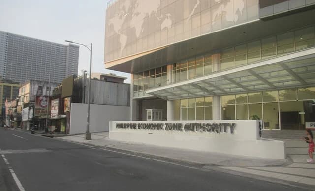 Building facade of the Philippine Economic Zone Authority with street view.