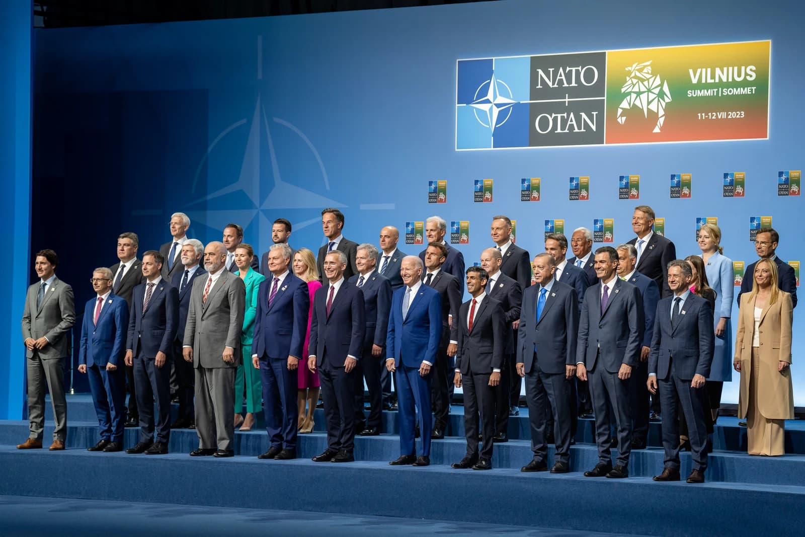 President Joe Biden and world leaders stand for a group photo at the NATO Summit.