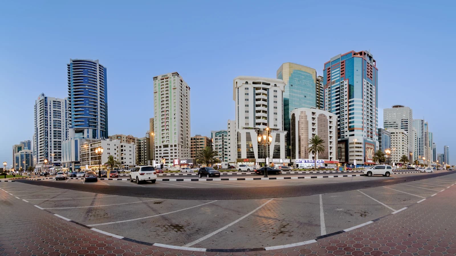 City skyline in Sharjah, United Arab Emirates, featuring modern high-rise buildings.