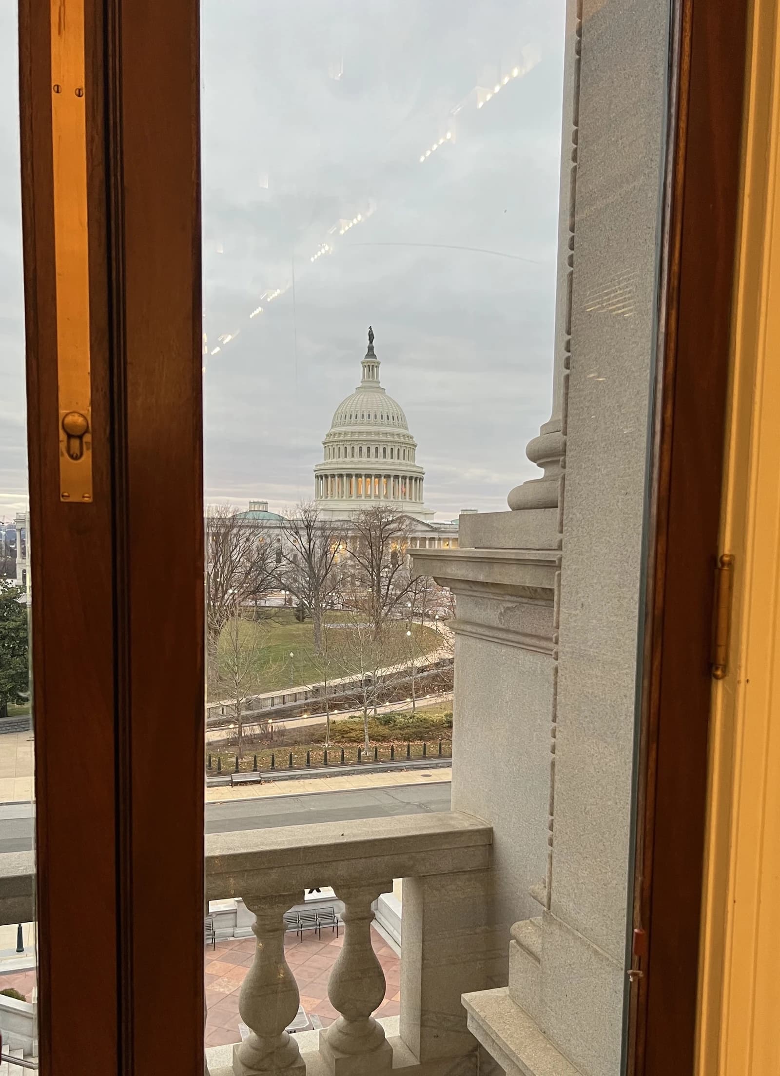 US Capitol Building dome seen from a window in a nearby building.