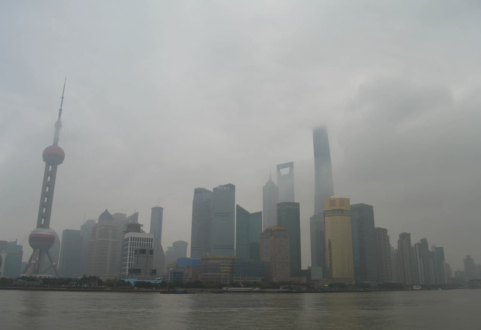 Shanghai financial district with modern skyscrapers and the Oriental Pearl TV Tower.
