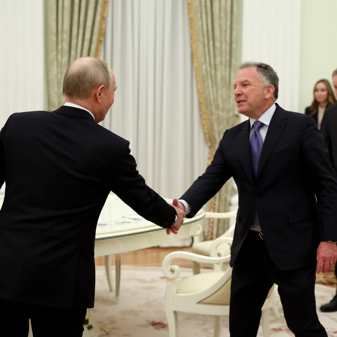 Vladimir Putin, President of Russia, shaking hands with Steve Witkoff, real estate developer.