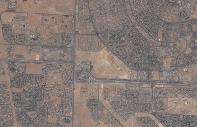 Aerial view of Madinat as-Sadis min Uktubar, including Nile University and Mall of Arabia.