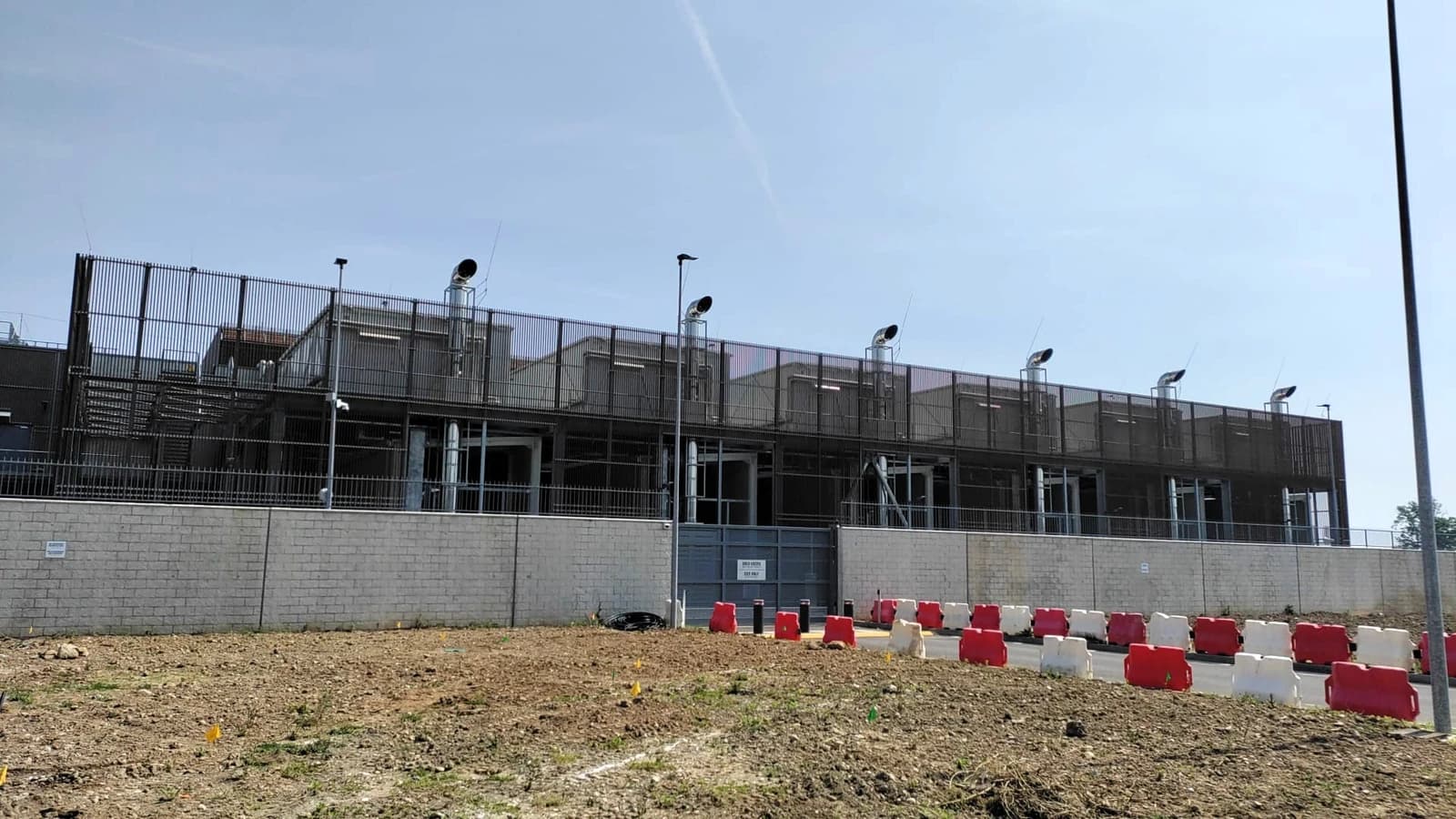Data center under construction, showing large diesel-powered generators.