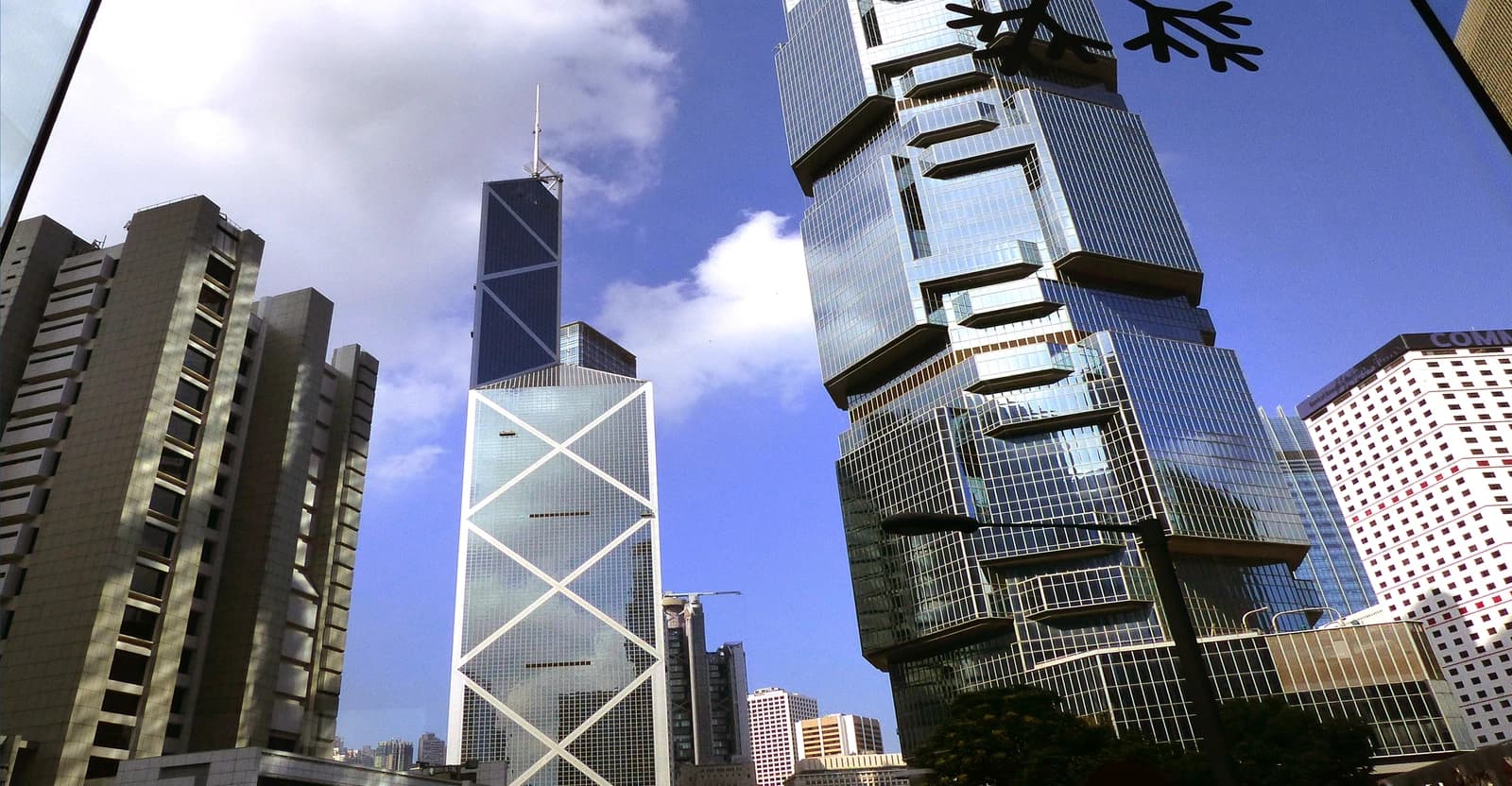 The iconic Bank of China Tower and the stacked Lippo Centre skyscrapers in Hong Kong.