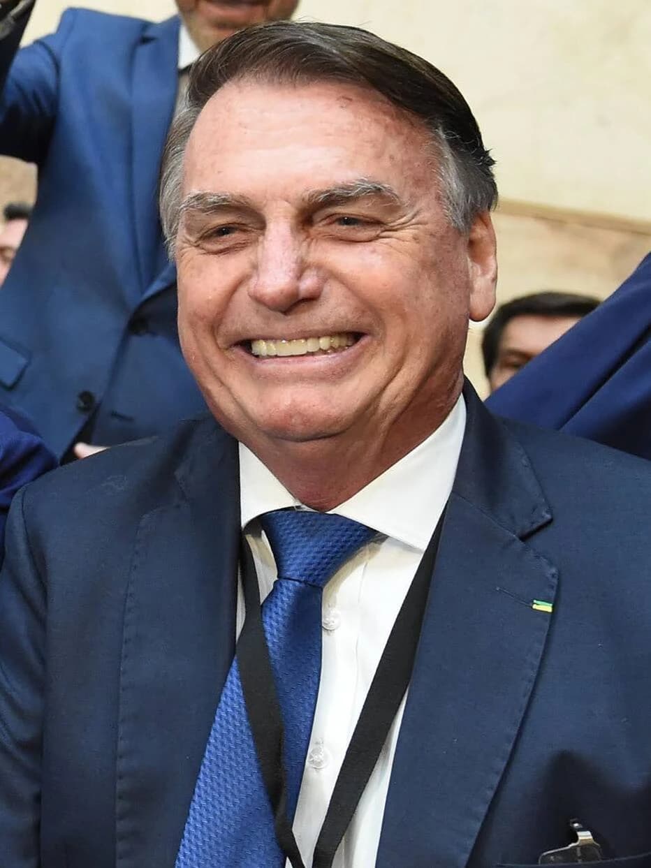 Jair Bolsonaro, former President of Brazil, smiling at a public event.