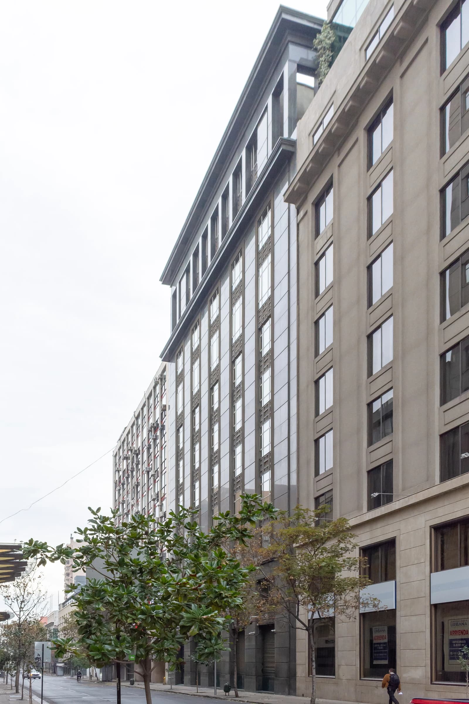 Empresas CMPC central headquarters building with modern glass and stone facade in Santiago.