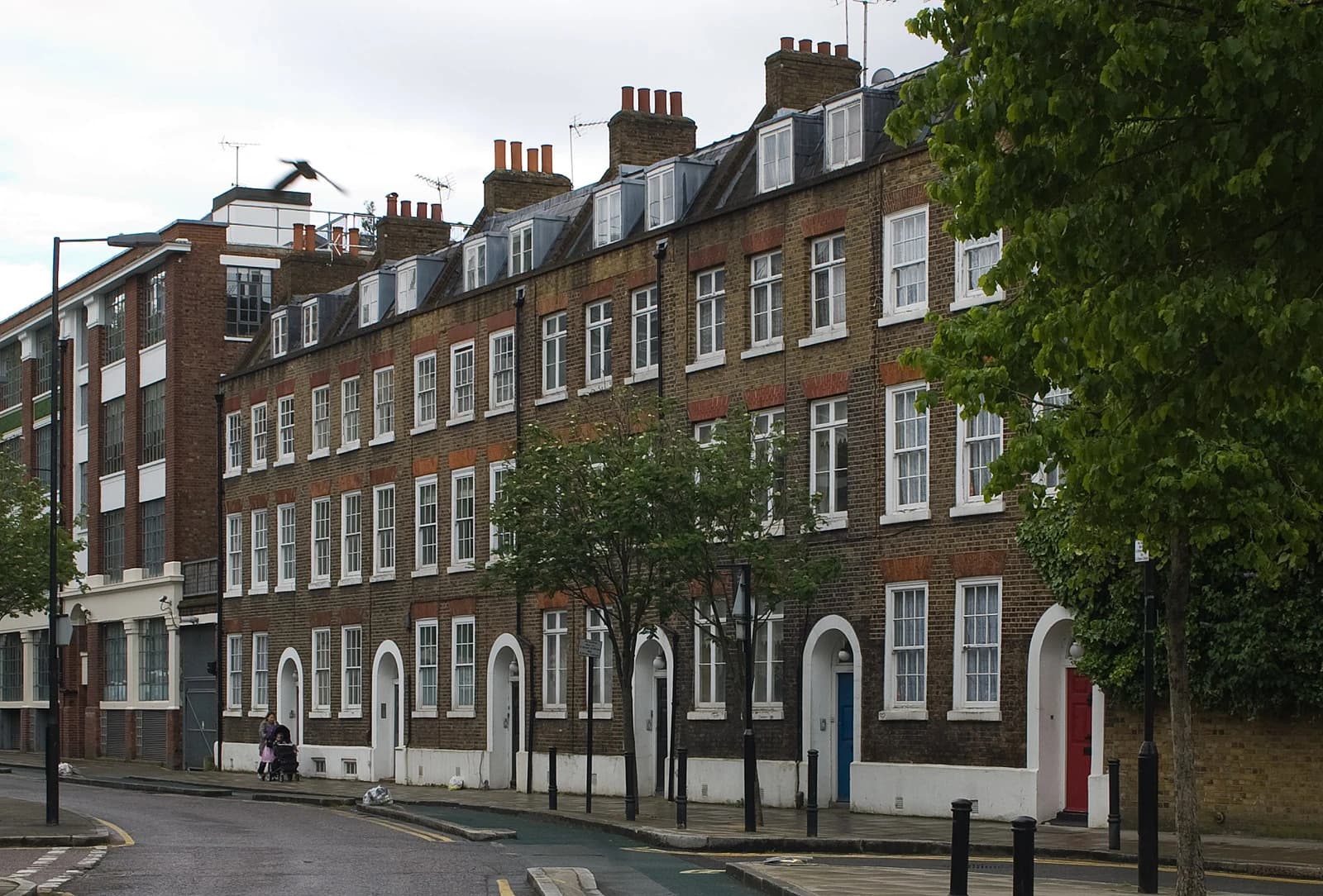Row of terraced houses on Skinner Street, with cars parked along the street.
