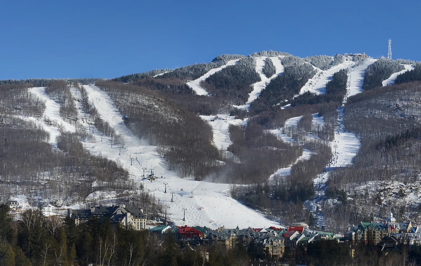 Ski Mont Tremblant ski resort showing snow-covered mountains and base village.
