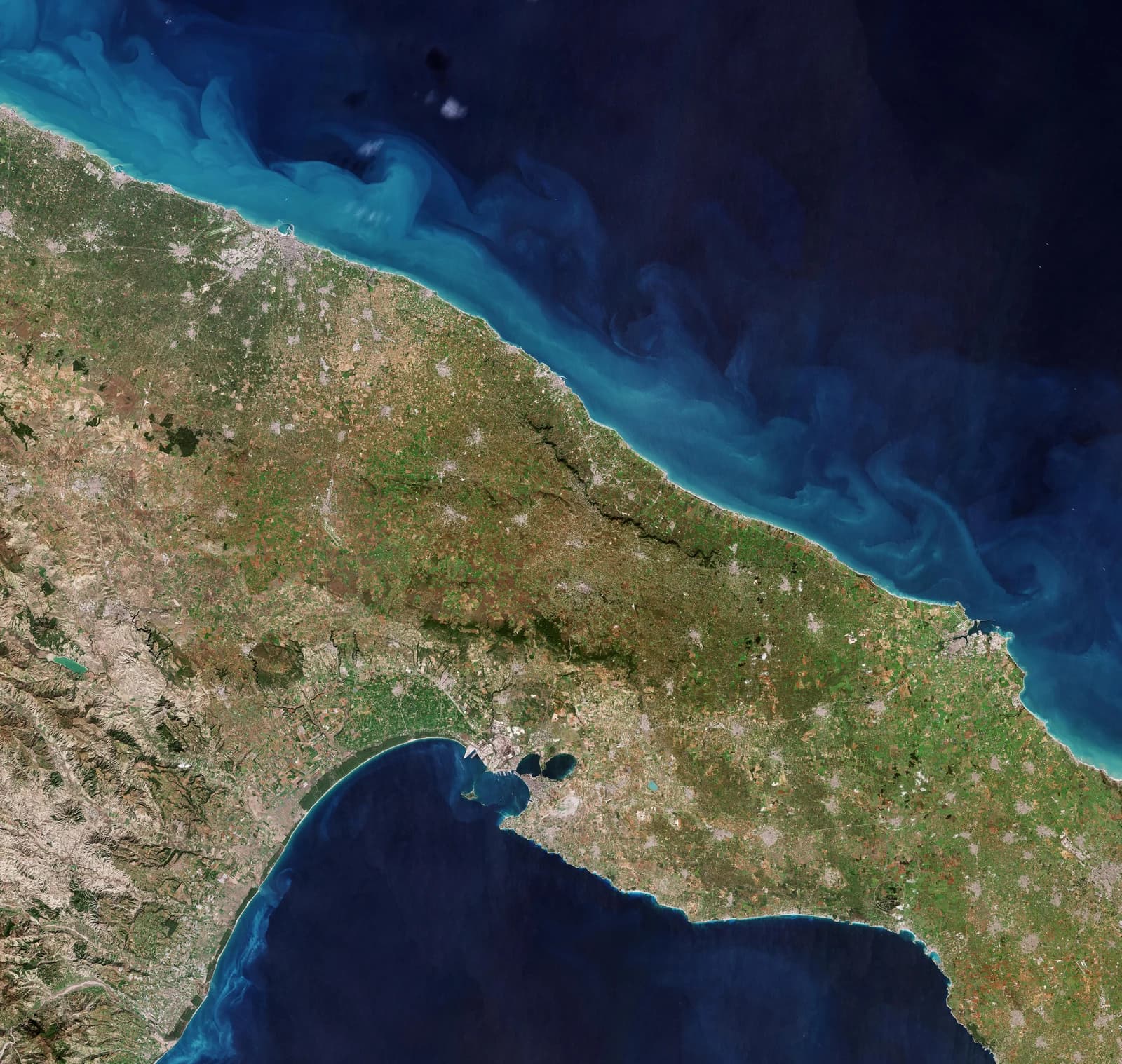 Satellite image of the Puglia region, Italy, bordering the Adriatic and Ionian Seas.
