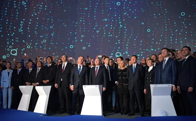 Vladimir Putin and other officials attending the first Yamal LNG tanker loading ceremony.