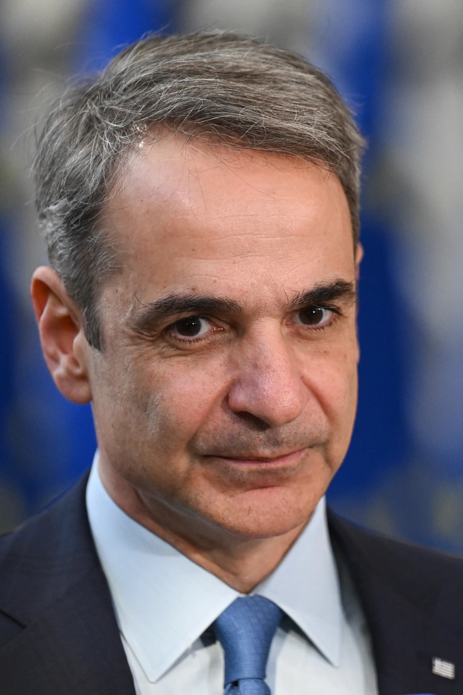 Kyriakos Mitsotakis, Prime Minister of Greece, looks directly at the camera.