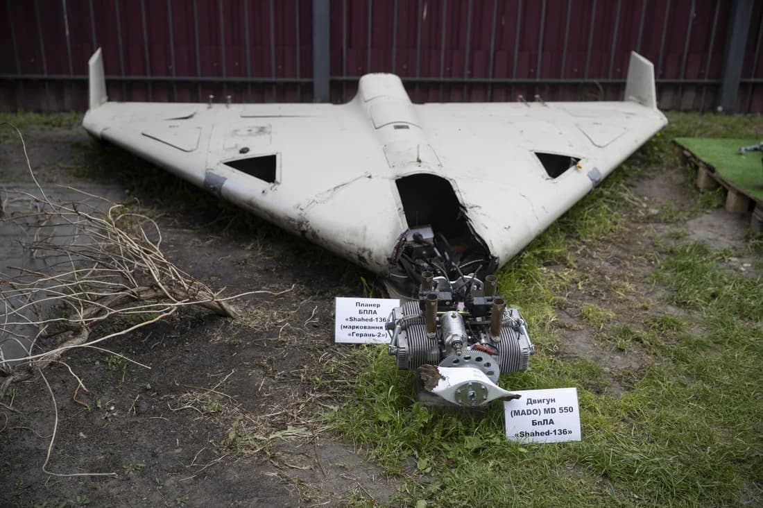 Remains of a Russian Shahed-136 drone and its engine displayed on the ground in Kyiv.
