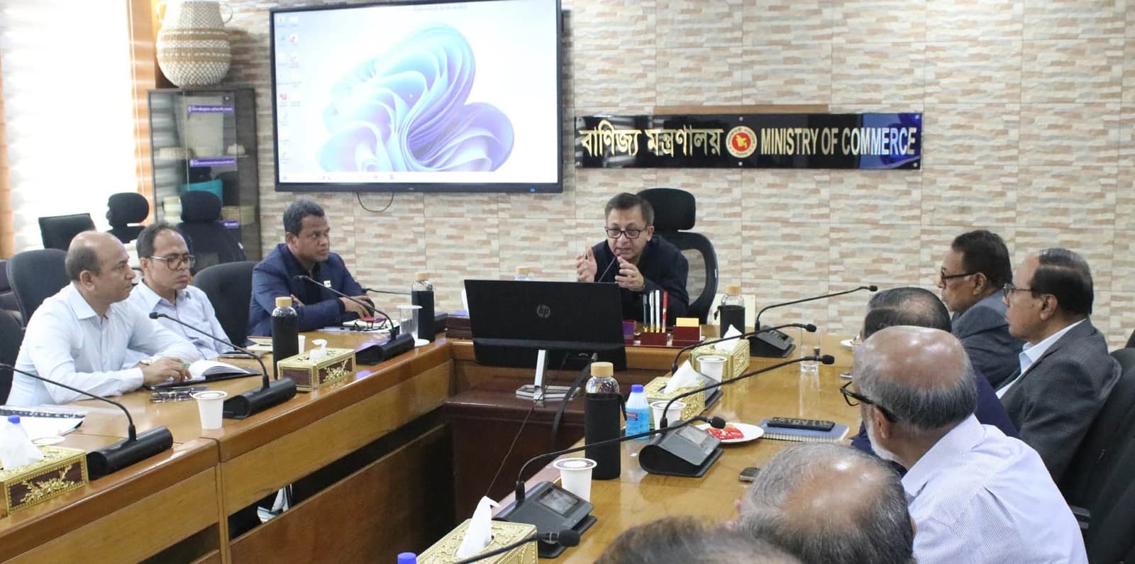 Khandaker Abdul Muqtadir, Minister of Commerce, speaking at a meeting in Dhaka.