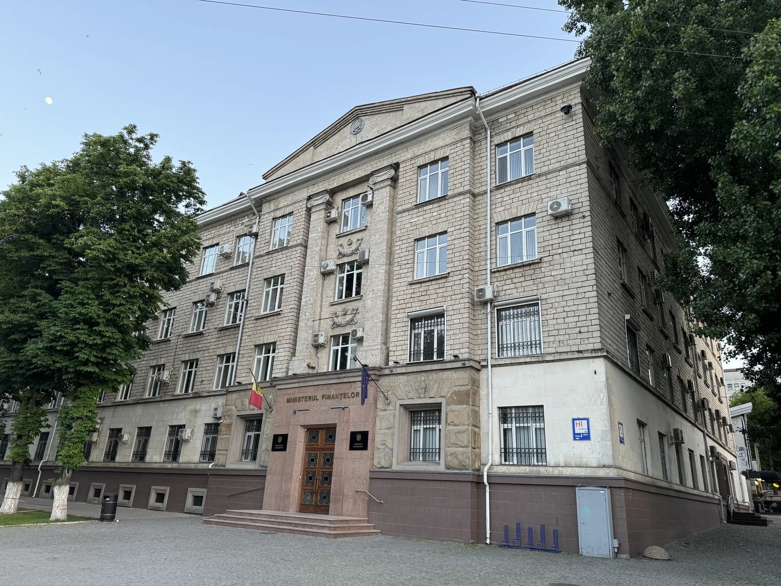 Exterior of the Ministry of Finance building in Moldova with a clear sky.