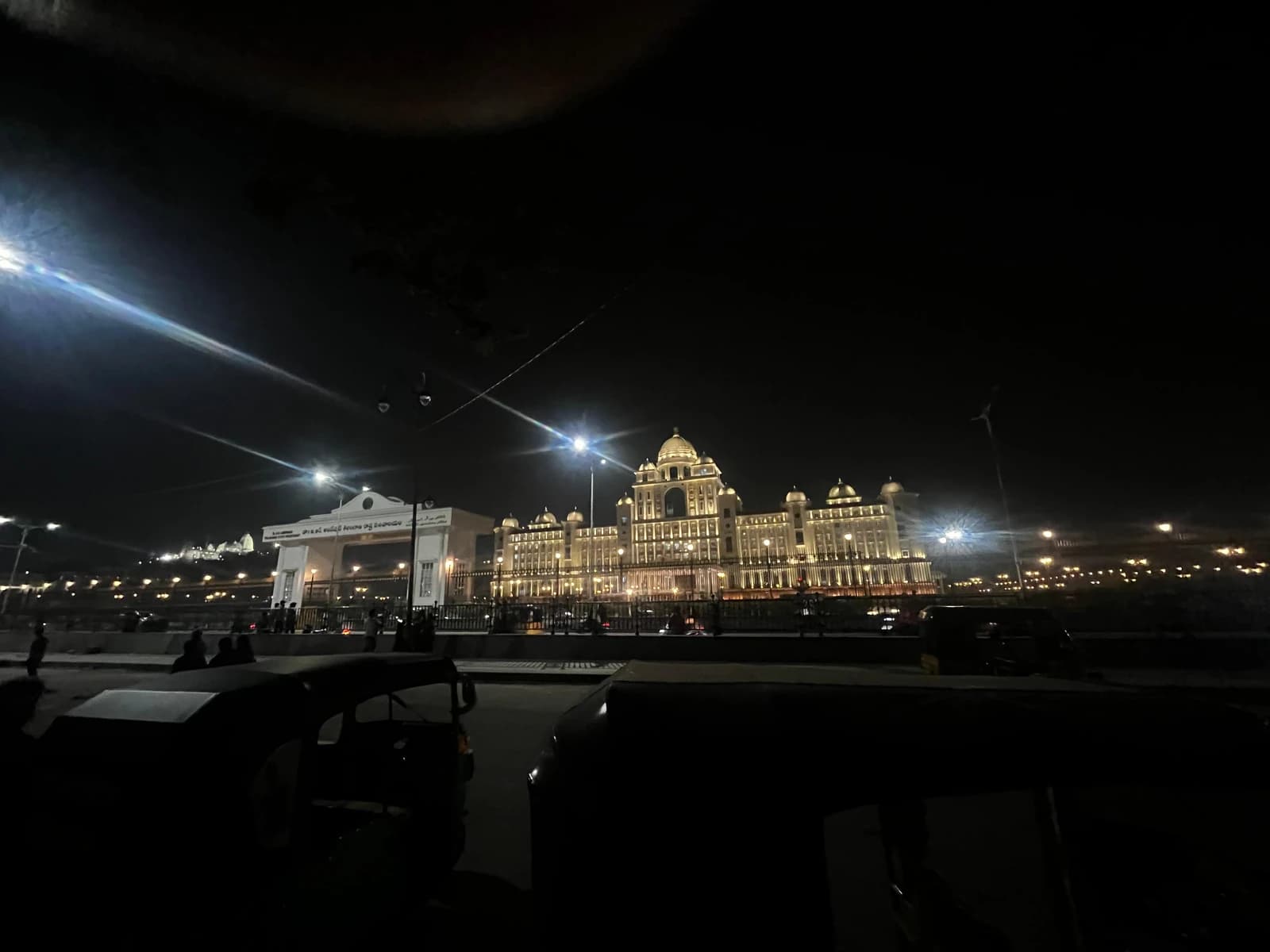 The Telangana State Legislature building is illuminated at night in Hyderabad.