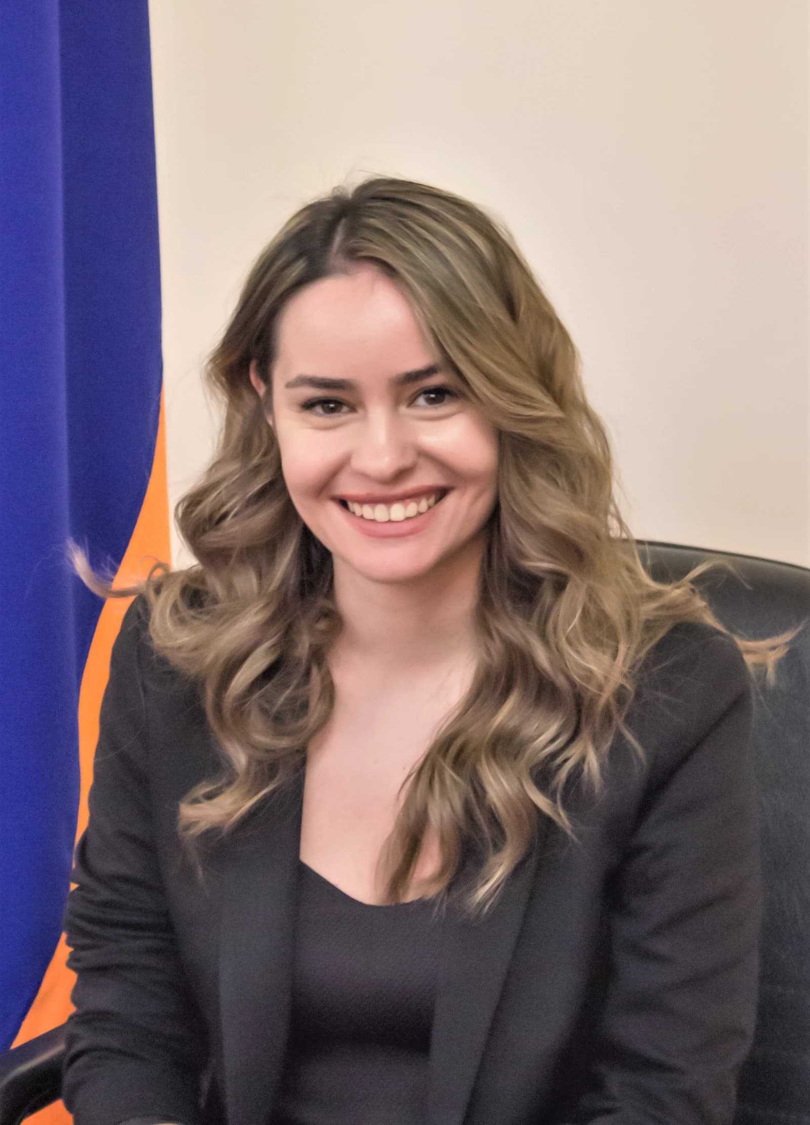 Sona Ghazaryan, member of CP, smiling in a formal setting.