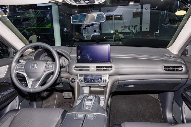 Interior of a Honda Avancier crossover, showing the dashboard and steering wheel.