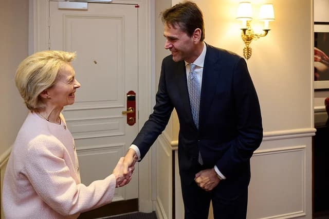 Ursula von der Leyen, President of the European Commission, shaking hands with Christophe Fouquet.
