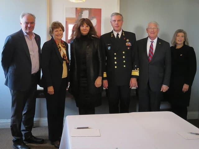 NATO Assistant Secretary and NATO Chair of Military Committee with other officials.