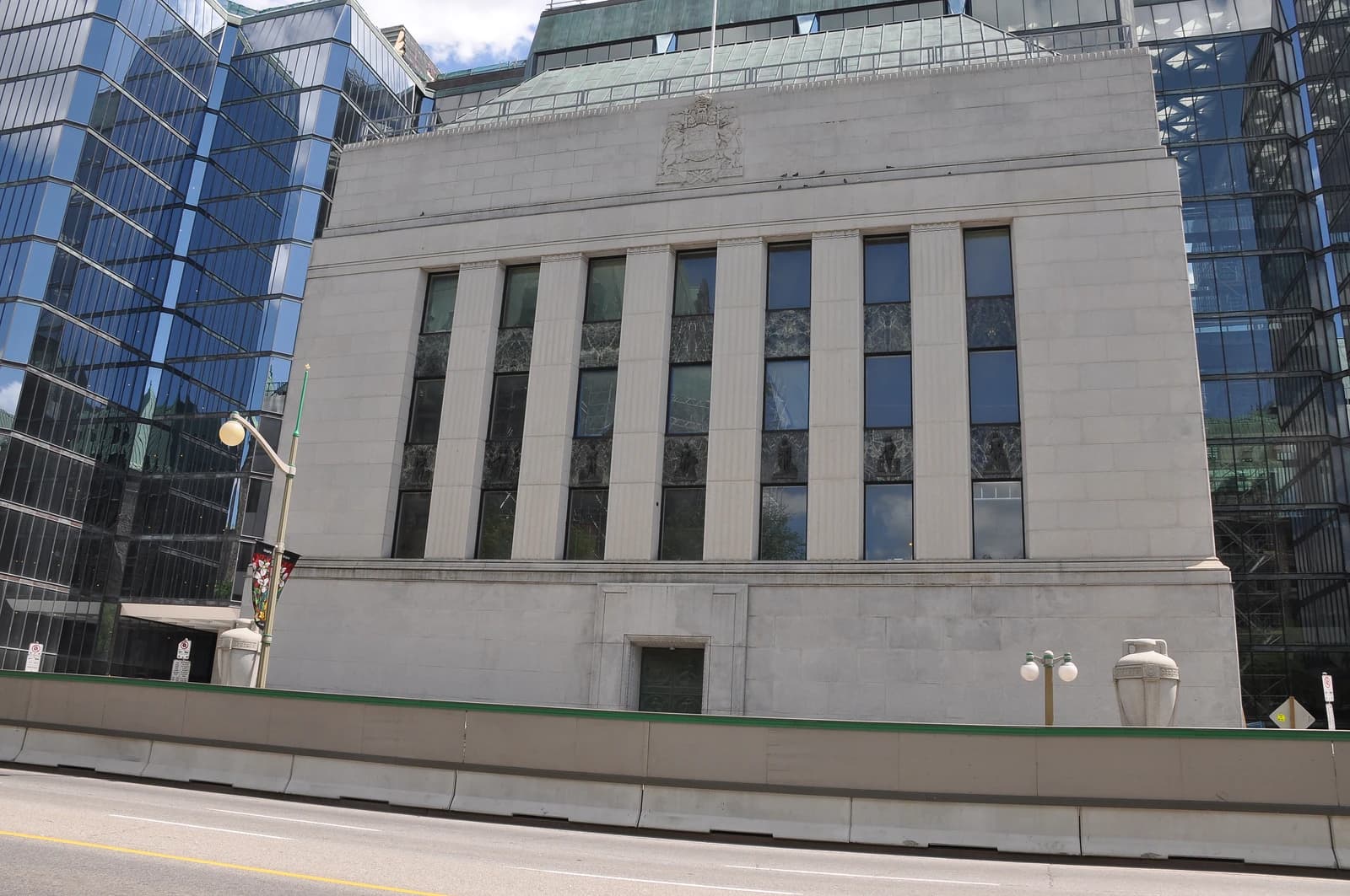 Exterior view of the Bank of Canada building, a large grey stone structure.