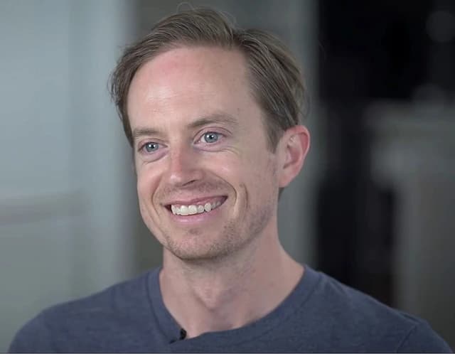 Erik Voorhees, a Bitcoin entrepreneur, smiling during an interview with Reason TV.