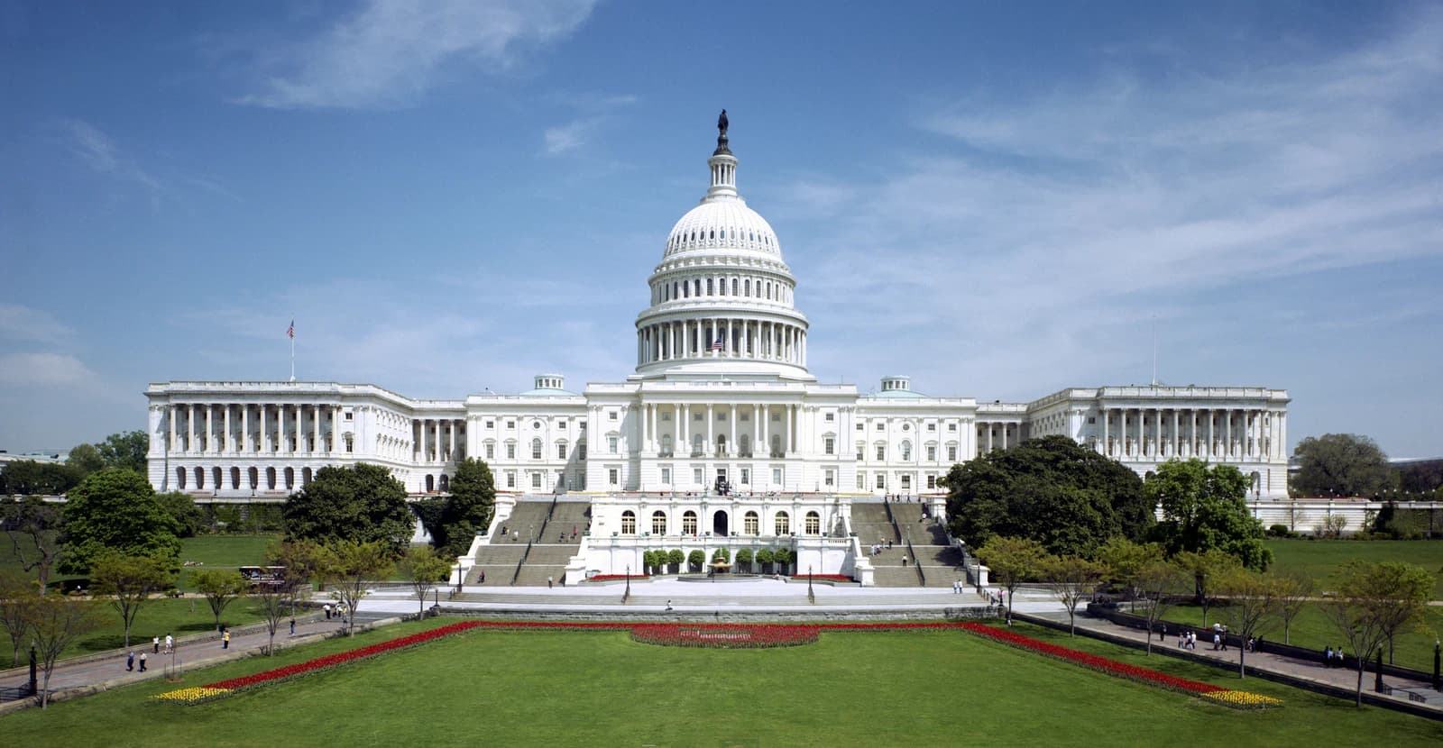 The United States Capitol building, seen from its west front, with a clear sky.