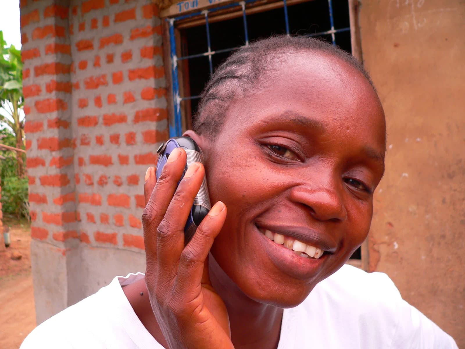 Woman from Basankusu in the Democratic Republic of Congo talking on a mobile phone.