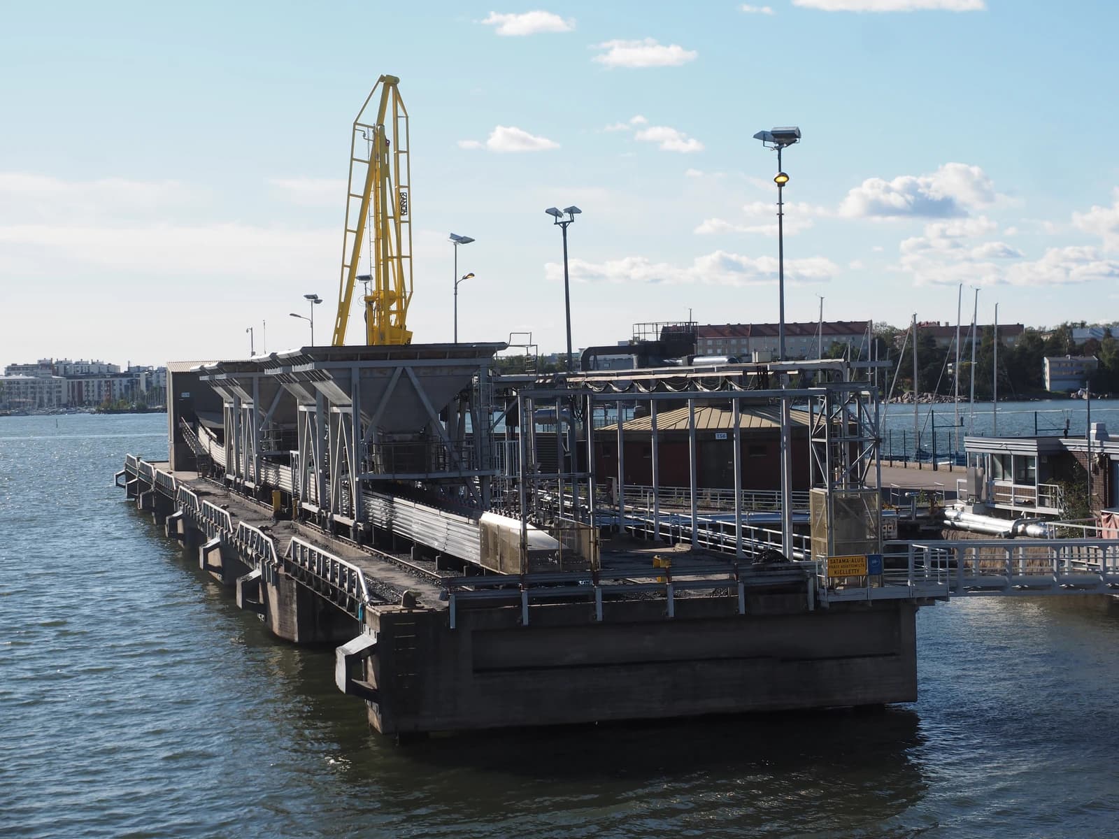 Coal unloading facility for Salmisaari power plant on a calm day.