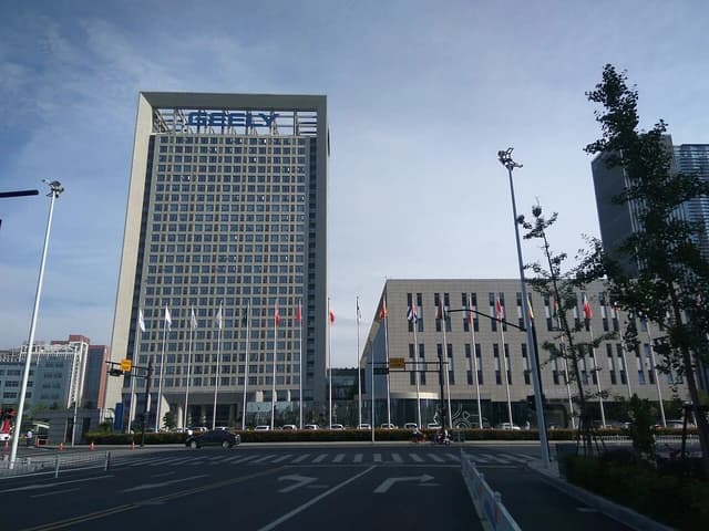 Exterior view of the Geely headquarters building, with the company name displayed at the top.