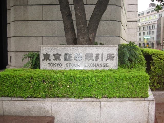 Stone sign with Japanese and English text for the Tokyo Stock Exchange.