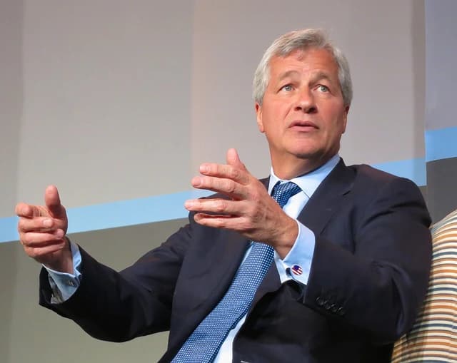 Jamie Dimon, CEO of JPMorgan Chase, speaking and gesturing with both hands.