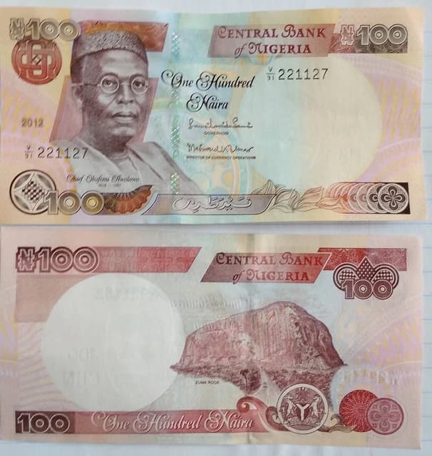 One Hundred Naira notes, showing the portrait of Chief Obafemi Awolowo and Zuma Rock.