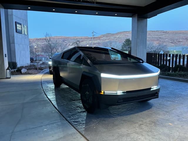 New Tesla Cybertruck parked outside building entrance in Moab, Utah.