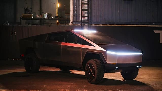 Tesla Cybertruck, the electric pickup truck, parked outdoors at night during its official unveiling.