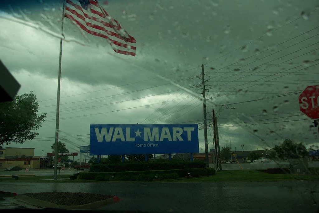Walmart Home Office sign in Bentonville, Arkansas, with an American flag flying.