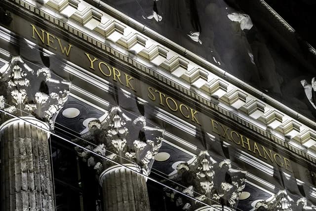 The gilded letters "NEW YORK STOCK EXCHANGE" on the building facade.