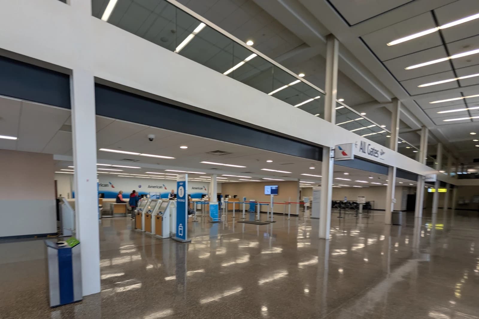 Empty American Airlines ticketing and check-in area at Tulsa International Airport.