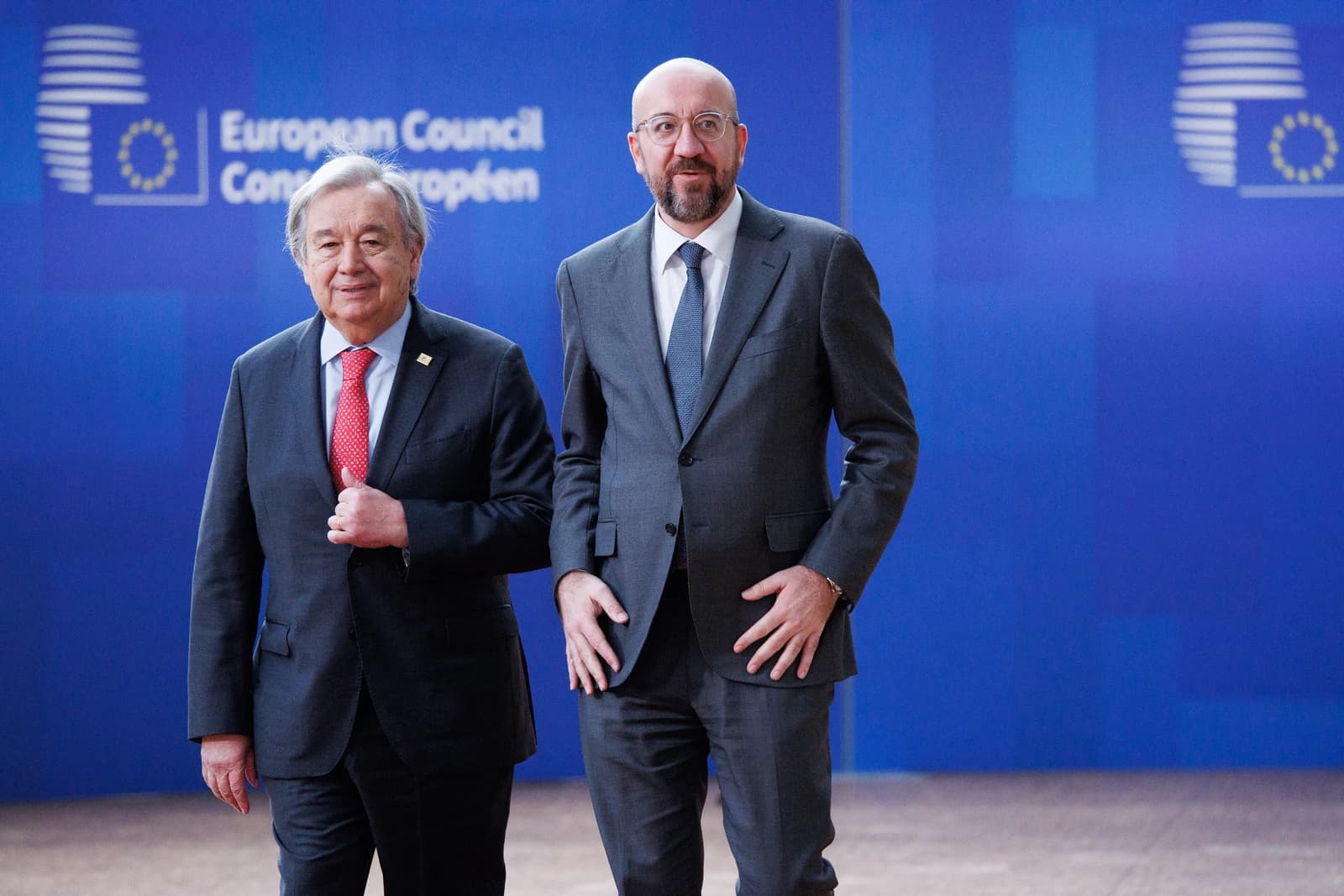 António Guterres and Charles Michel standing side-by-side at a European Council meeting.