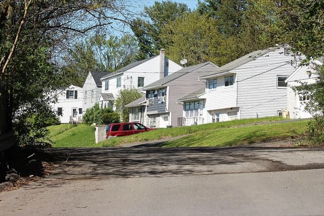 Suburban dwellings in Lansingburgh, New York, viewed from a street.
