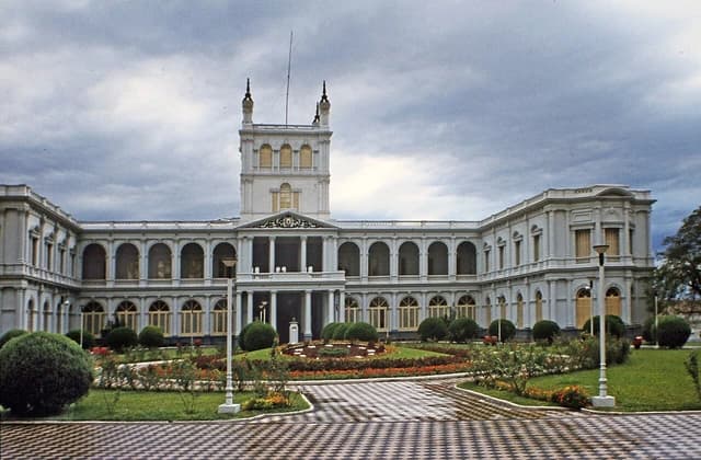 The Palacio de los López building, the presidential palace of Paraguay, under a cloudy sky.