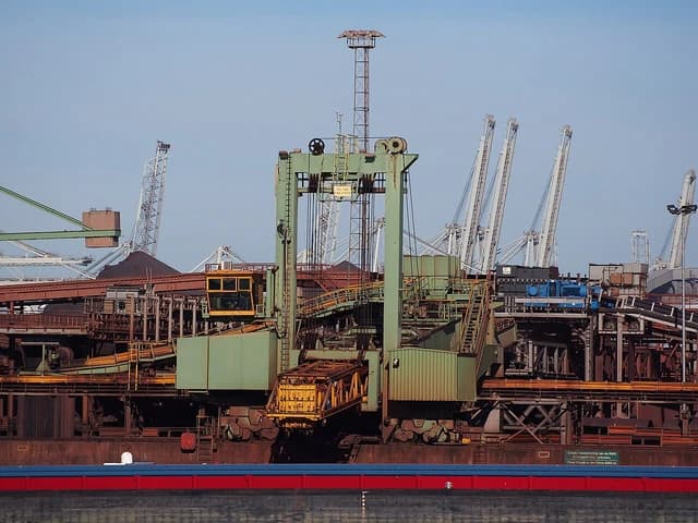 Industrial cranes and conveyors at the EMO terminal in Hartelhaven port.