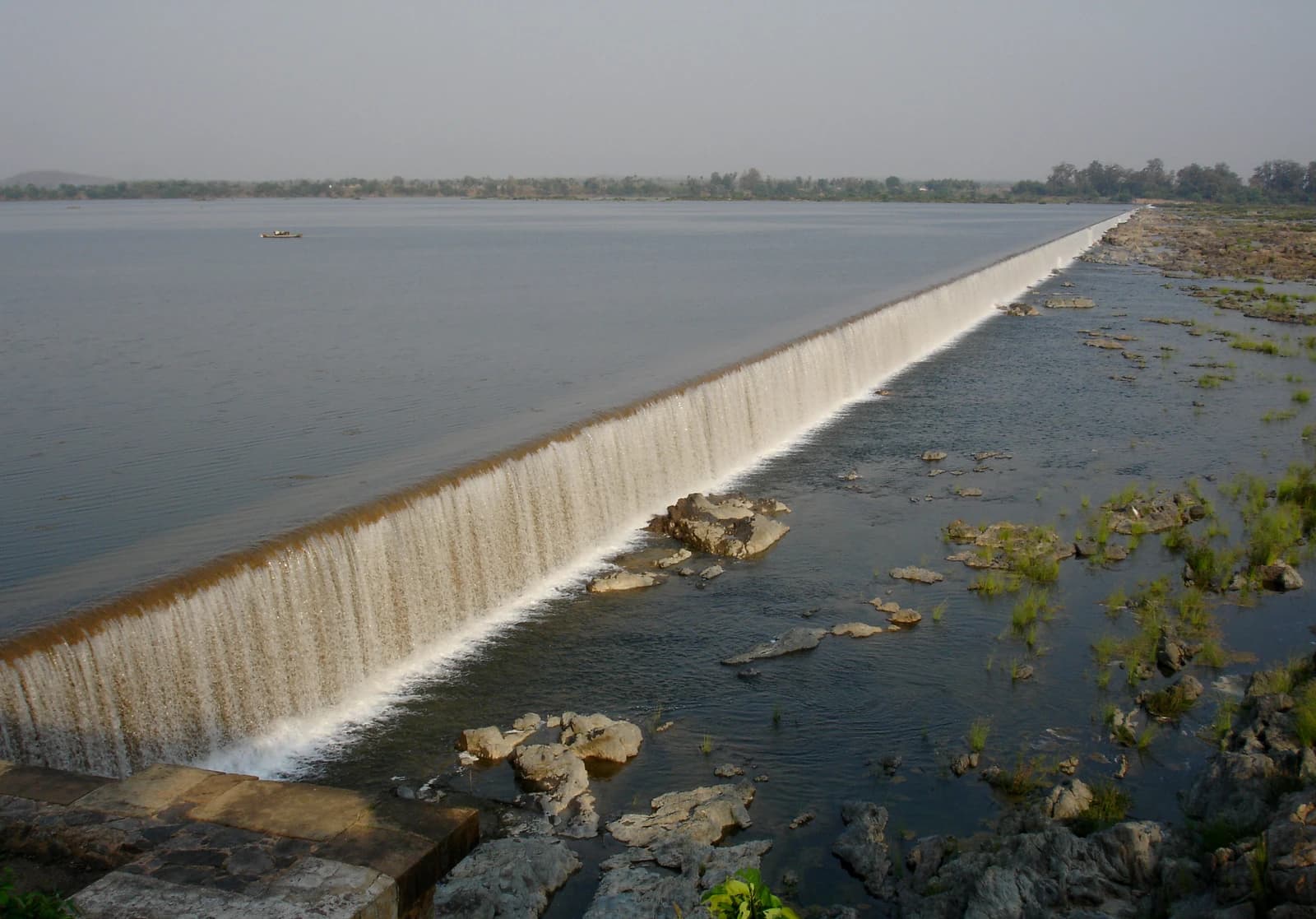Water flows over the Dummugudem Barrage on the Godavari River in Khammam District.