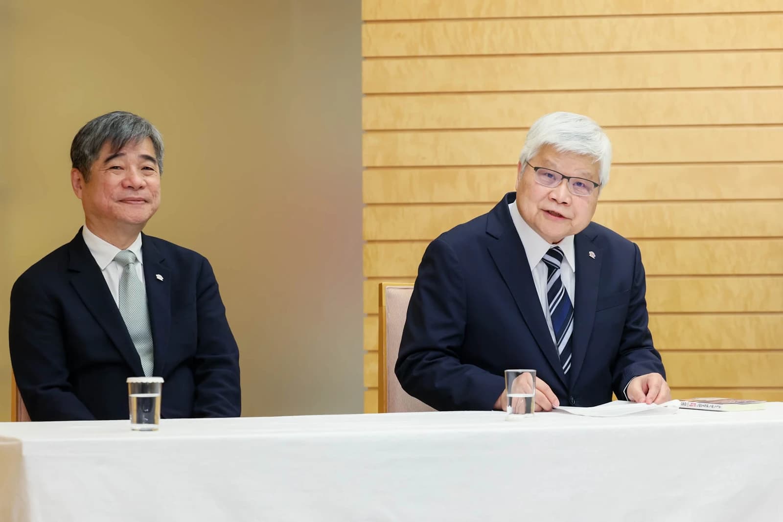 C.C. Wei, TSMC CEO, and another executive sitting at a table during a meeting.