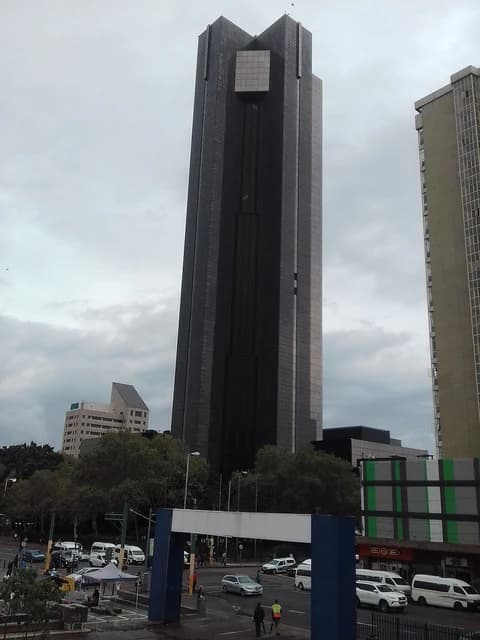 The South African Reserve Bank Building, a tall dark skyscraper, in Pretoria.