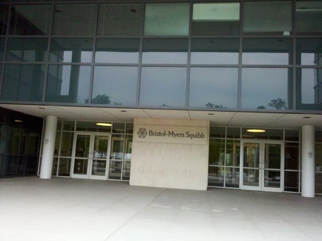 Bristol-Myers Squibb building entrance at 100 Nassau Park Boulevard, showing company signage.
