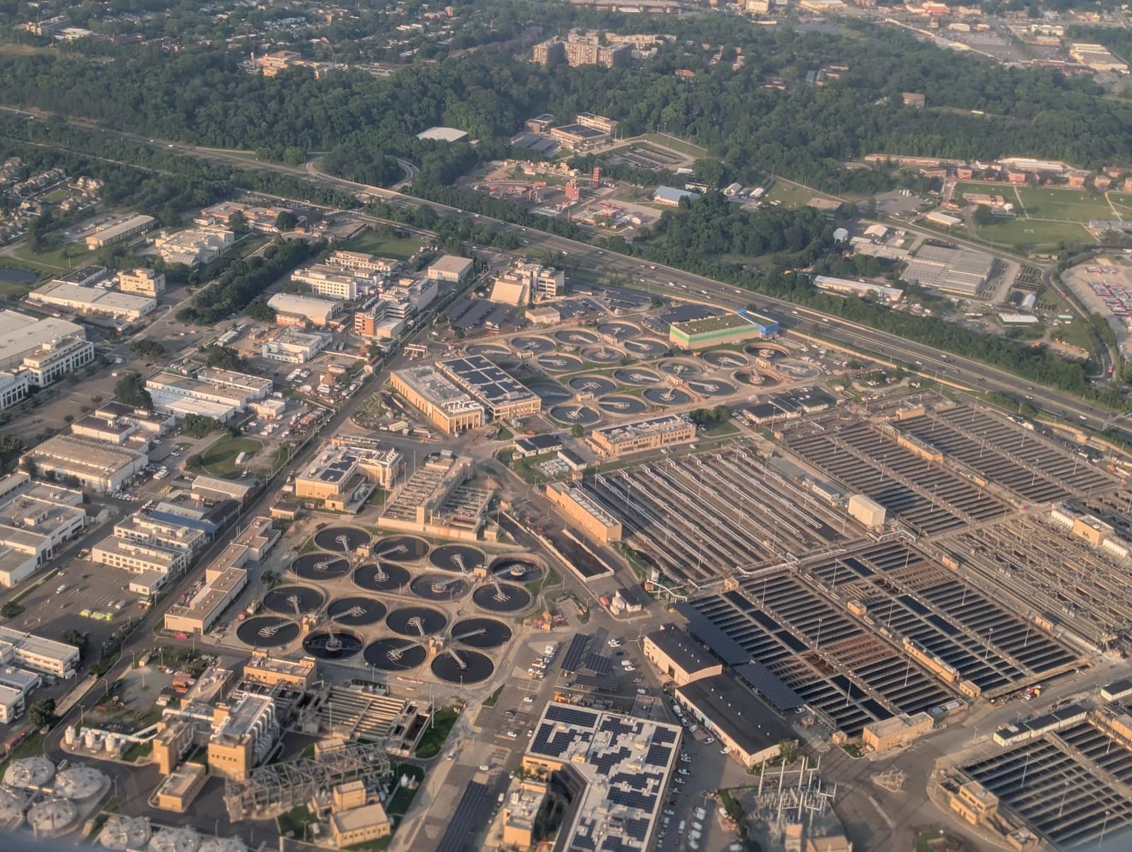 Aerial view of Blue Plains Advanced Wastewater Treatment Plant, a large facility with many circular tanks.