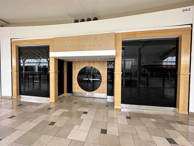 Vacant storefront with large windows at Exton Square Mall in Exton, Pennsylvania.
