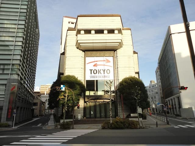 Tokyo Stock Exchange building with streets and other buildings nearby.